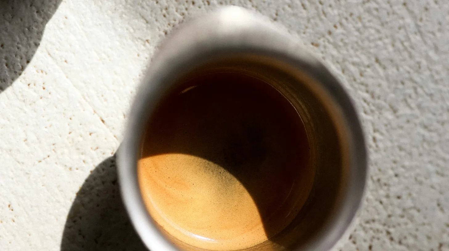 Two small cups of espresso with golden crema